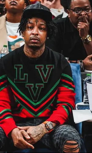21 Savage wearing Louis Vuitton cap
