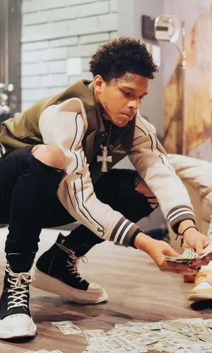 K Suave wearing Amiri jacket