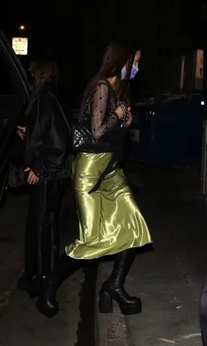 Olivia Rodrigo’s Outfit in Naked Wolfe Boots, Chanel Bag & No Dress (2022)