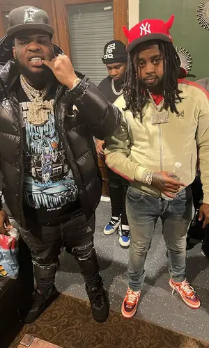 Maxo Kream’s Outfit in Moncler Jacket, Warren Lotas T-Shirt & New Era Cap (2022)