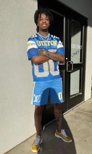 21 Savage wearing Louis Vuitton t-shirt