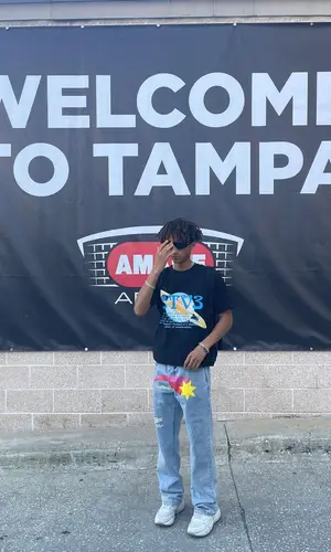Jaden Smith wearing Jaden Smith Merch t-shirt