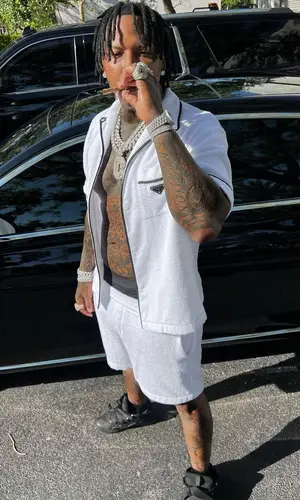 Moneybagg Yo wearing Prada shirt