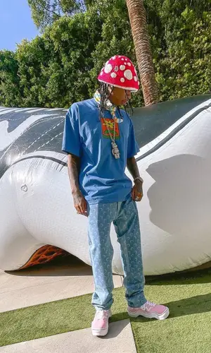 Tyga wearing 99%IS hat