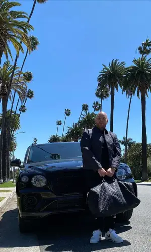 Fat Joe wearing Bottega Veneta bag