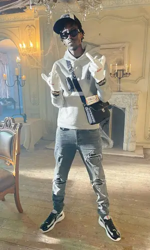 Unknown T wearing Amiri jeans