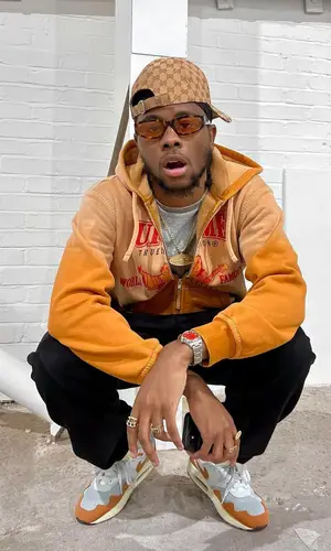 Lundun wearing Gucci cap