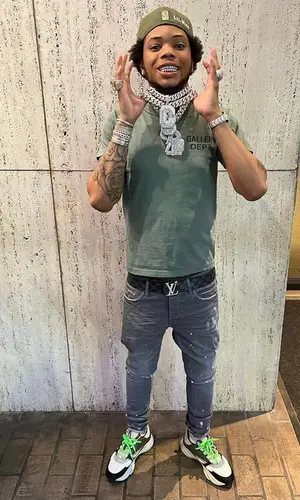 Lil Migo wearing Dior sneakers