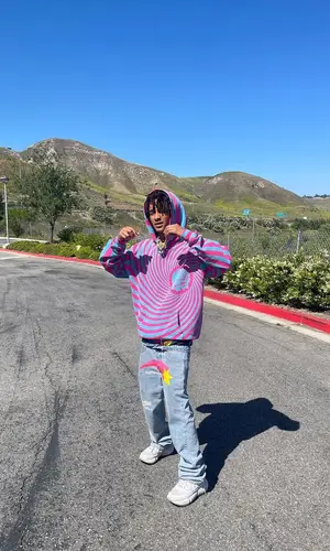 Jaden Smith wearing Jaden Smith Merch sneakers