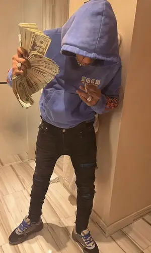 Dougie B wearing Amiri hoody