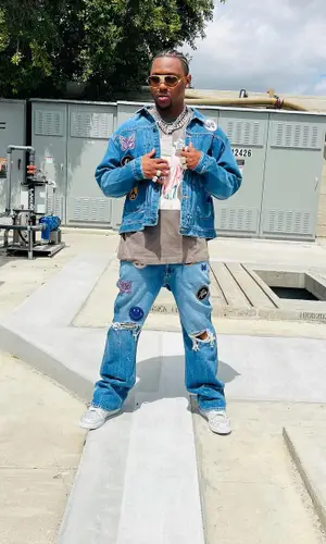 HitBoy’s Outfit in Denim Tears T-Shirt, Needles Jeans & Nike Sneakers (2022)