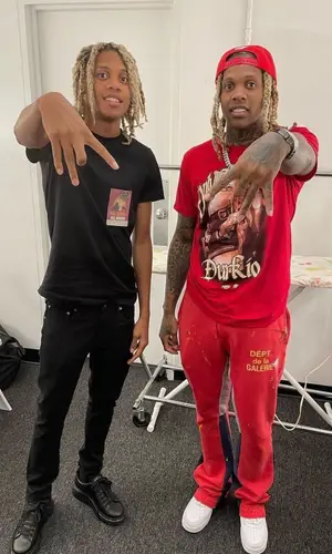 Lil Durk wearing OTF cap