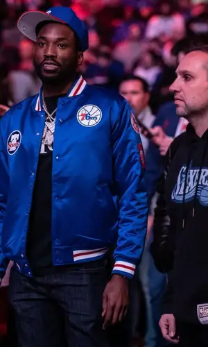 Meek Mill wearing Mitchell & Ness jacket