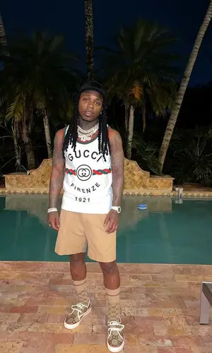 Jacquees wearing Gucci top