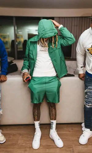 Lil Durk’s Outfit in Prada Jacket, Nike Sneakers & Rhude Socks (2022)