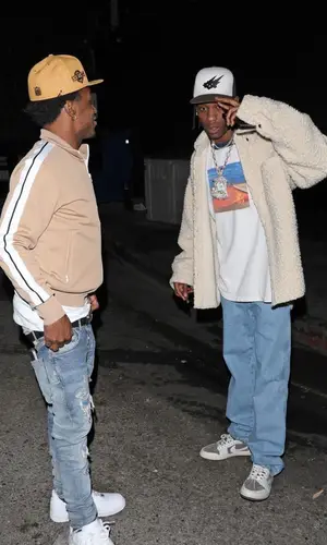 Travis Scott wearing Cout De La Liberte shirt
