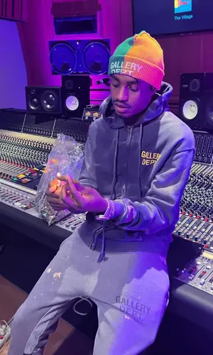 Lil Tjay wearing Gallery Dept. pants