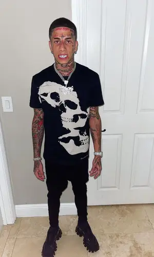 Flyysoulja wearing Amiri jeans
