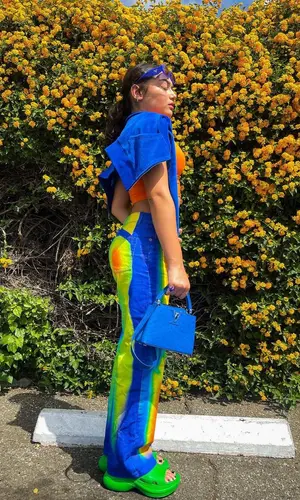 Avani Gregg wearing Louis Vuitton bag