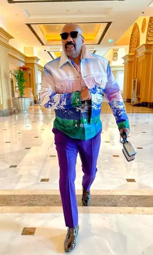 Steve Harvey wearing Louis Vuitton shirt