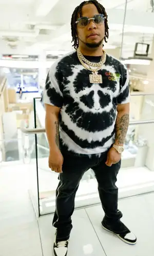 Don Q wearing Gallery Dept. t-shirt