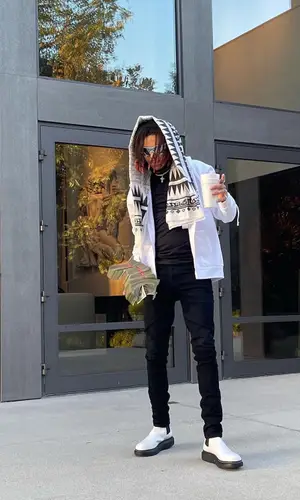 SeptembersRich wearing Chrome Hearts hoody