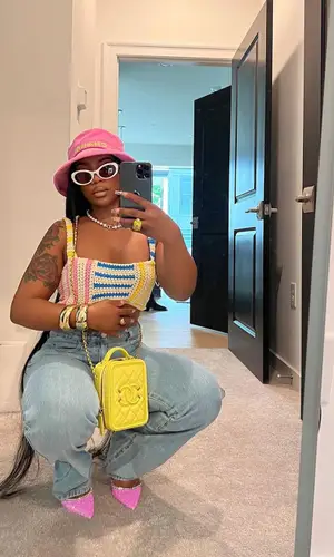 De'arra Taylor wearing Amina Muaddi sandal