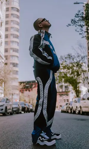J Balvin’s Outfit in Louis Vuitton Jacket, Wavy Baby Sneakers & Rick Owens Eyewear (2022)