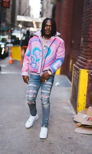 Booka 600 wearing Amiri jeans