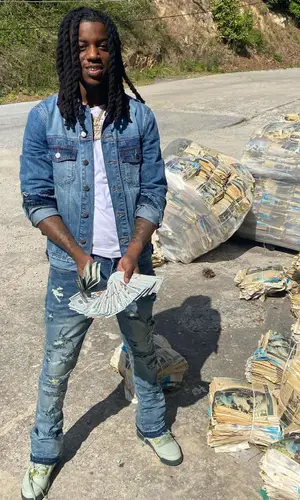 OMB Peezy wearing Ricco Gioventu jacket