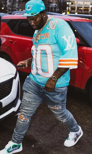 Peezy wearing Louis Vuitton jersey