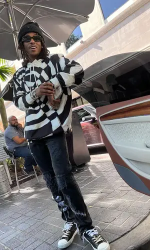 Rich The Kid wearing Celine hoody