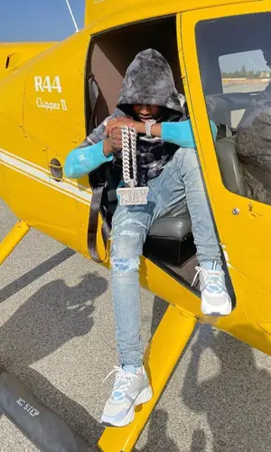 Lil Tjay wearing Amiri jeans
