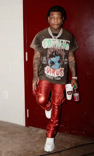 Rylo Rodriguez wearing Prada boots