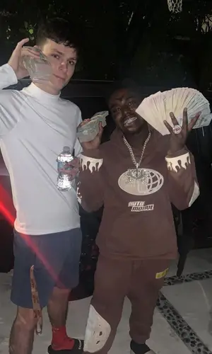 Kodak Black wearing Local Trap Star hoody