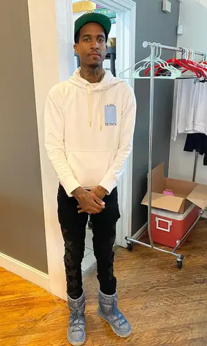 Lil Reese wearing Dior boots