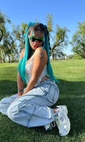 Karol G wearing Dion Lee top