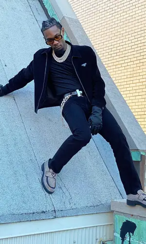 Offset wearing Prada wallet