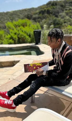 Soulja Boy wearing Pleasures shirt