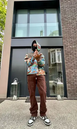 Digga D wearing Amiri jeans