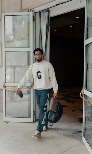 Donovan Mitchell’s Outfit in Fear of God Sweatshirt, Kapital Jeans & Dior Sneakers (2022)
