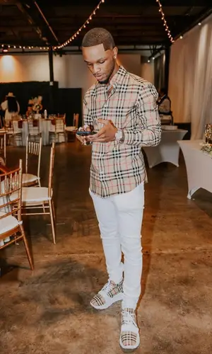 Toosii wearing Burberry shirt