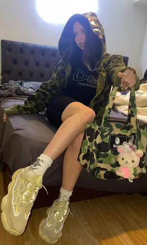 Saramalacara wearing Bape bag
