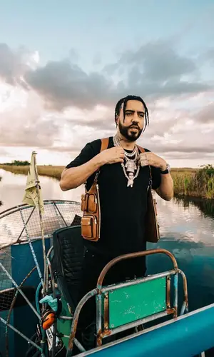 French Montana wearing Amiri jeans