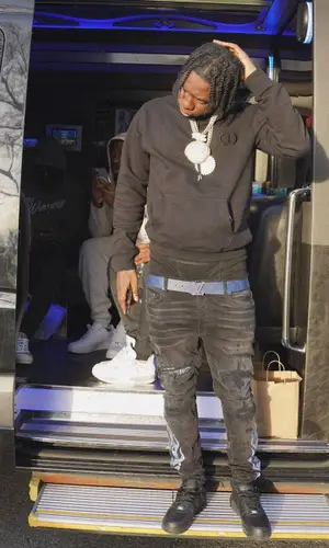 Sleepy Hallow wearing Amiri jeans