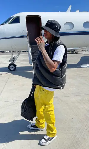 Tyga wearing Mastermind hat