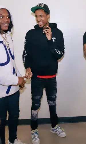 Lil Reese wearing Amiri jeans
