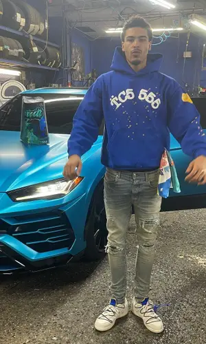 Jay Critch’s Outfit in Spider Worldwide Hoodie, Amiri Jeans & Nike Sneakers (2022)