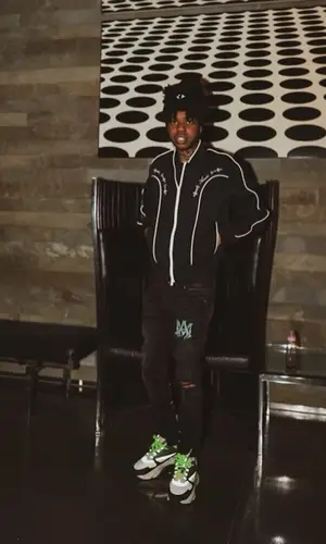 Lil Poppa wearing Dior hat