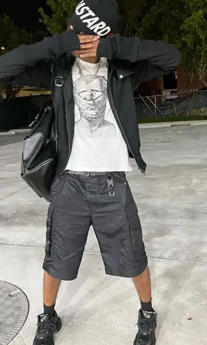 Onlybino wearing Alyx shorts